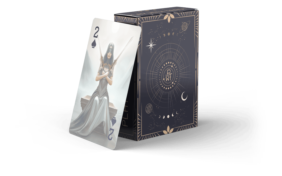 A playing card and its box are displayed. The card shows the 2 of spades with an illustrated woman in a flowing silver dress. The box has an ornate celestial design with planets, stars, and geometric shapes.